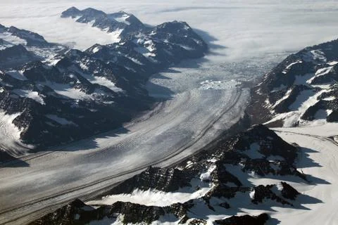 Aerial view of a glacier front and mountains in Greenland Stock Photos