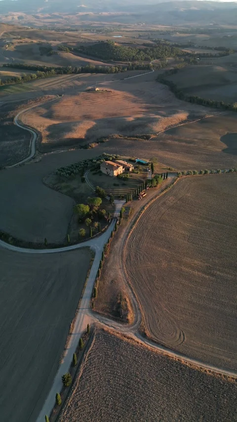 Aerial View of Gladiator cypress road in Pienza Tuscany Italy during sunset Stock Footage 250385751