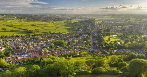 Aerial view of Glastonbury on a sunny summer evening, Somerset, England, United Stock Photos