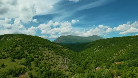 Aerial view glides over lush green hills. Vrmdza Fortress. Serbia Stock Footage 338021811