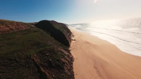 Aerial view glides past towering red cliffs Stock Footage 341821465
