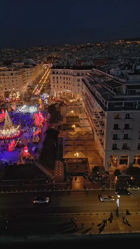 Aerial view of glowing central square New Year celebration at night Stock Footage 345935947