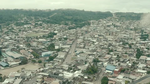 Aerial view going over a large city in South America showing the main street Stock Footage 146343968