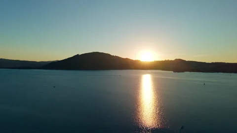 Aerial view of golden sunset reflection over Lake Attersee in Austrian Alps Stockbeeldmateriaal 345610786