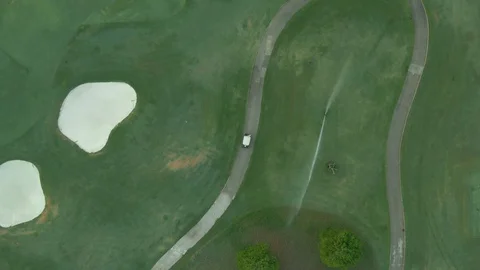 Aerial view of a golf cart on a golf course Stock Footage