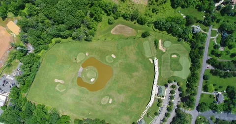 An aerial view of a golf complex in suburban Maryland Stock Footage 132920105