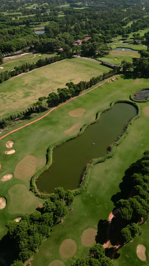 Aerial view of the golf course in Antalya Belek at sunset. 4K Vertical Stock Footage 260535461