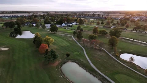 Aerial View of Golf Course with Autumn Foliage at Sunset Stock Footage 345100047