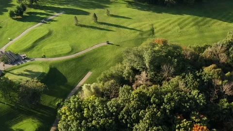 Aerial view of Golf Course. Drone flying over pond, trees, golf course Stock Footage 116795278