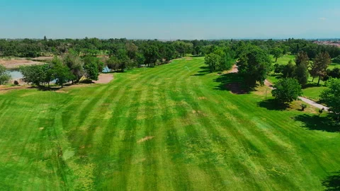 Aerial view of Golf course. Establishing shot, drone flying over golf club Stock Footage 246348343