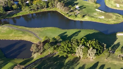 Aerial View of Golf Course Fairway with Water Hazard and Bunkers 動画素材 339752226