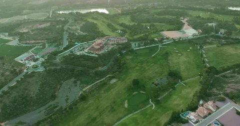 Aerial view. Golf course with green field in the valley. Green turf scenery. 스톡 동영상 128038166