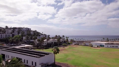 Aerial View of Golf Course, Hillside Houses and Ocean Horizon in Fuerteventura Stock Footage 309014759