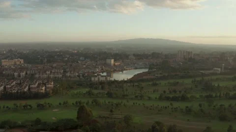 Aerial view of golf course, middle class flats and slum Stock Footage 148202571
