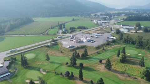 Aerial View of a Golf Course in a Mountain Valley Stock Footage 318817724