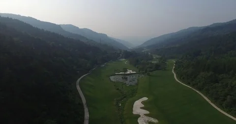 Aerial view of Golf course surrounded by mountains, Shanxi China Stock Footage 70998230