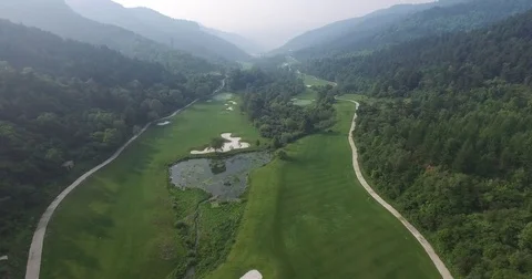 Aerial view of Golf course surrounded by mountains, Shanxi China Stock Footage 70998652