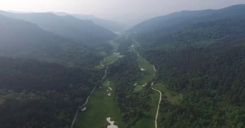 Aerial view of Golf course surrounded by mountains, Shanxi China Stock Footage 70998990