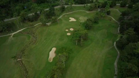 Aerial View of Golf Course Surrounded by Lush Green Landscape Video stock 311302105