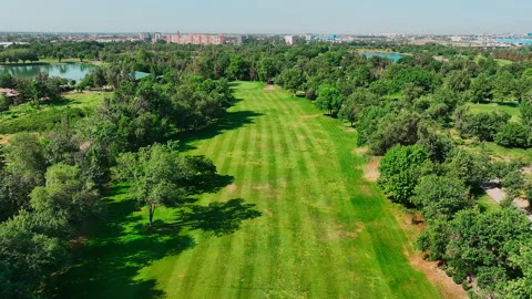 Aerial view of golf course with water hazard. Drone flying over golf course Stock Footage 246755893