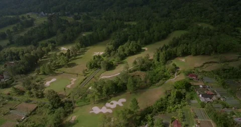 Aerial view of golf field at Bedugul, Bali, Indonesia. Drone view Vidéo 252574838