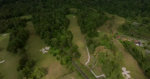 Aerial view of golf field at Bedugul, Bali, Indonesia. Drone view Stock Footage 253105425