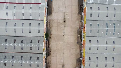 Aerial view of a goods distribution warehouse lined up with goods trucks pa.. Stock Footage 295879264