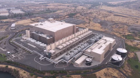 Aerial view of the Google data center in The Dalles, Oregon Stock Footage 345521859