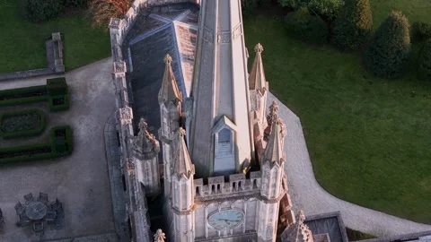 Aerial view of gothic cathedral spire with clock face and golden rooster we.. 스톡 동영상 337630423