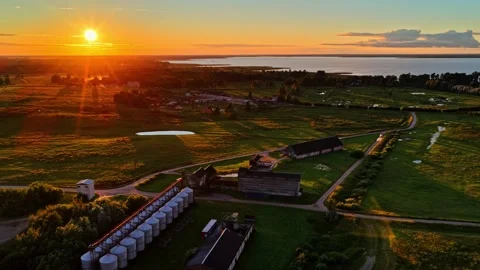 Aerial view of a grain elevator and silo facility during a beautiful sunset Stock Footage 343978965