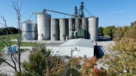 Aerial view of grain storage silos facility in rural Canada Stock Footage 317554079