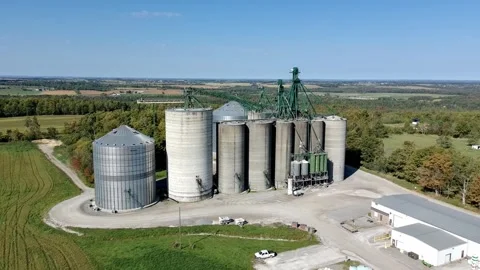 Aerial view of grain storage silos and facility, Canada Stock Footage 317554130