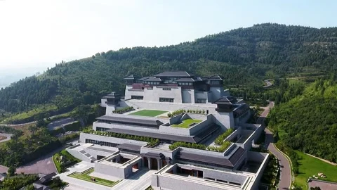Aerial view of grand complex against green hills. Stock Footage 336322102