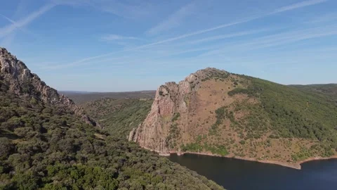 Aerial view of a granite cliff above a winding river Stockbeeldmateriaal 343324574
