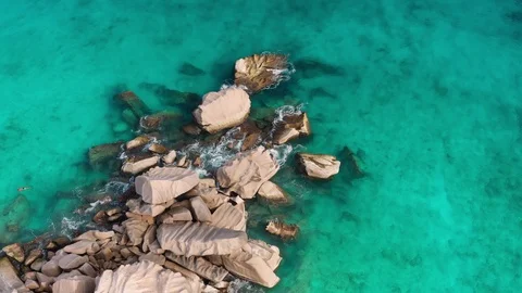 Aerial view of granite mound between beaches on La Digue Island, Seychelles Stock Footage 100681713