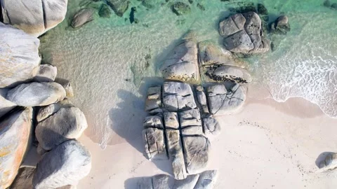 Aerial view of granite rocks on a sandy beach The Concept of wild nature Stock Footage 335762862