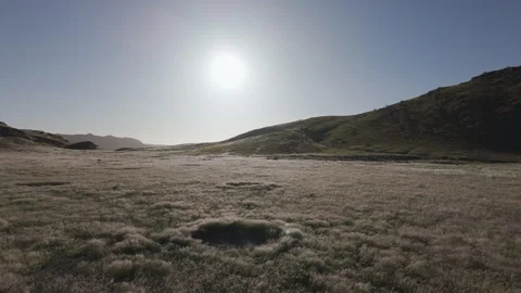 Aerial view of grass moving in the wind with fairy circle in Namibia Stock Footage 335314875