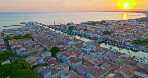 Aerial view of the Grau du Roi fishing village at sunrise in Camargue, a resort Stock Footage 327653602