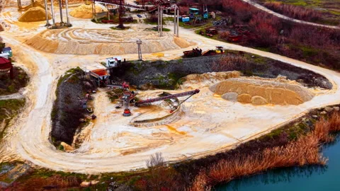 Aerial view of gravel processing site by lake, Bulgaria Stockbeeldmateriaal 341761328