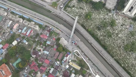 Aerial view of graveyard, bridge and housing area in Kampung Baru Stock Footage 150290615