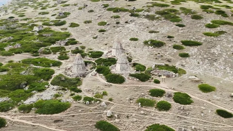 Aerial view of the gray stone crypts of the city of the dead, Caucasus. Bright Stock Footage 166716429