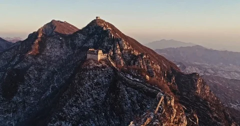 Aerial View of the Great Wall Covered with Snow under Sunset Stock Footage 121049065