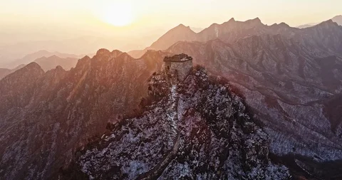 Aerial View of the Great Wall Covered with Snow under Sunset Stock Footage 121049235