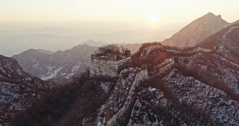 Aerial View of the Great Wall Covered with Snow under Sunset Stock Footage 121049465