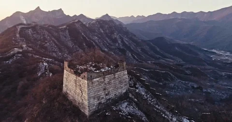 Aerial View of the Great Wall Covered with Snow under Sunset Stock Footage 121049575