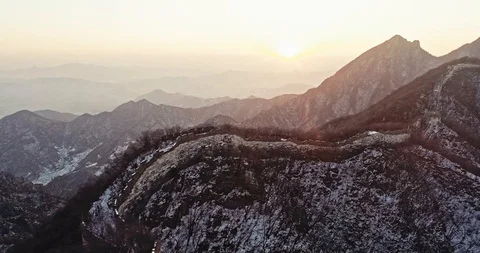 Aerial View of the Great Wall Covered with Snow under Sunset Stock Footage 121049643