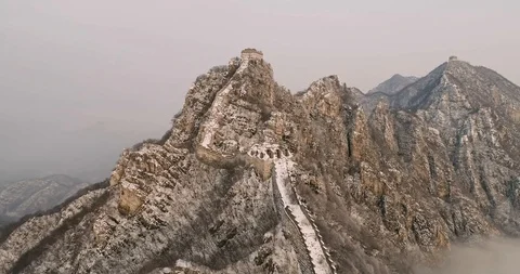 Aerial View of the Great Wall Covered with Snow under Sunset Stock Footage 121545927