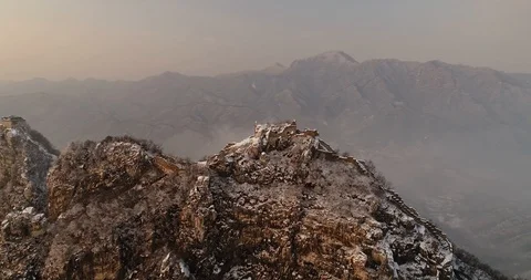 Aerial View of the Great Wall Covered with Snow under Sunset Stock Footage 121546250