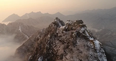 Aerial View of the Great Wall Covered with Snow under Sunset Stock Footage 121546390
