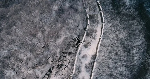Aerial View of the Great Wall Covered with Snow under Sunset Stock Footage 121546432